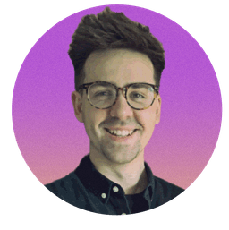 Smiling picture of me, Guy Turner. Dark hair, swept up. Dark glasses. Green collared shirt. Pink gradient background. Pixelated, heavily compressed 90s image aesthetic.